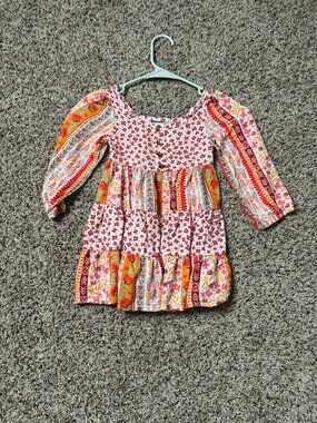 This boho-style dress for girls is from Vince Camuto. It features a design with